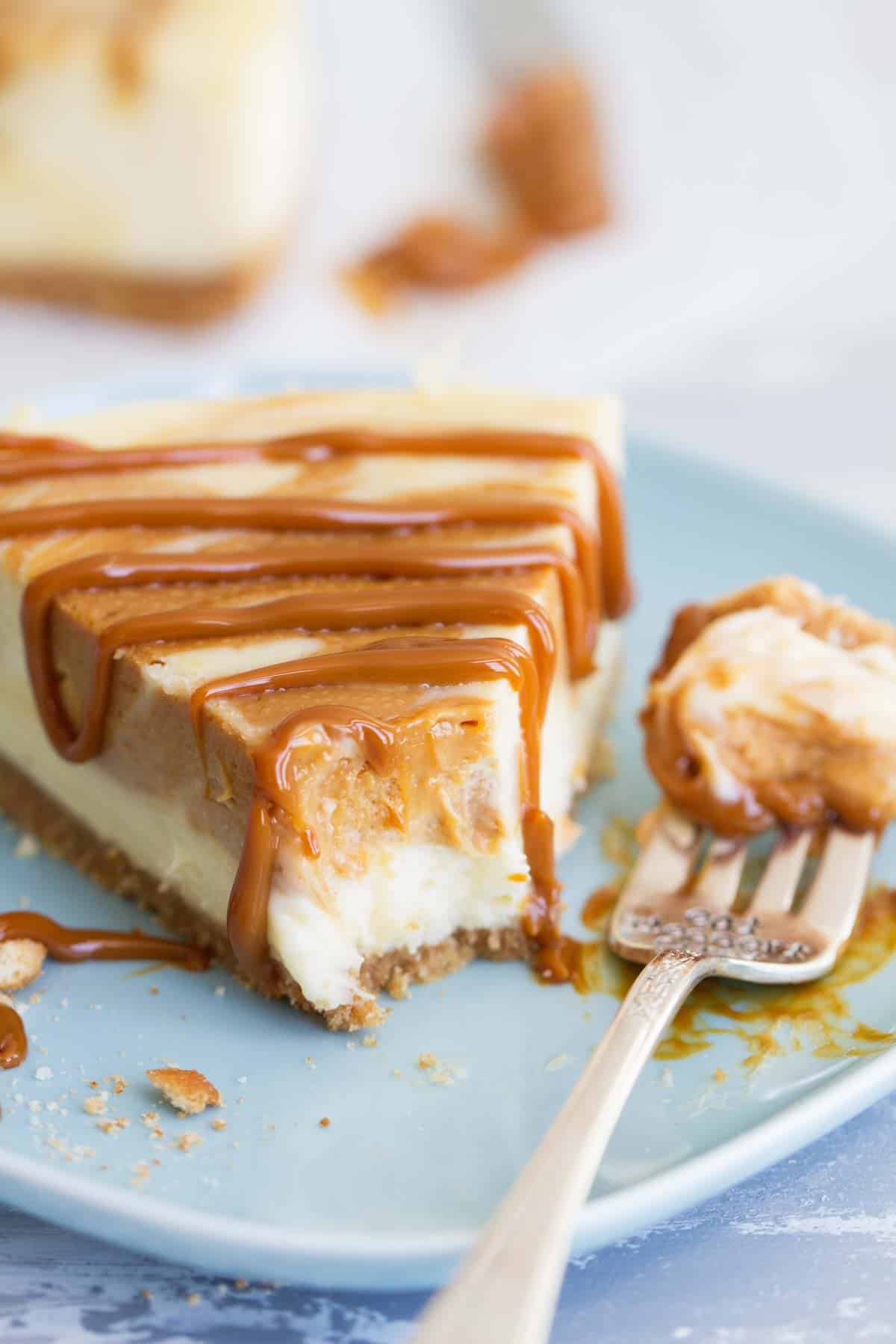 dulce de leche cheesecake with bite taken from it