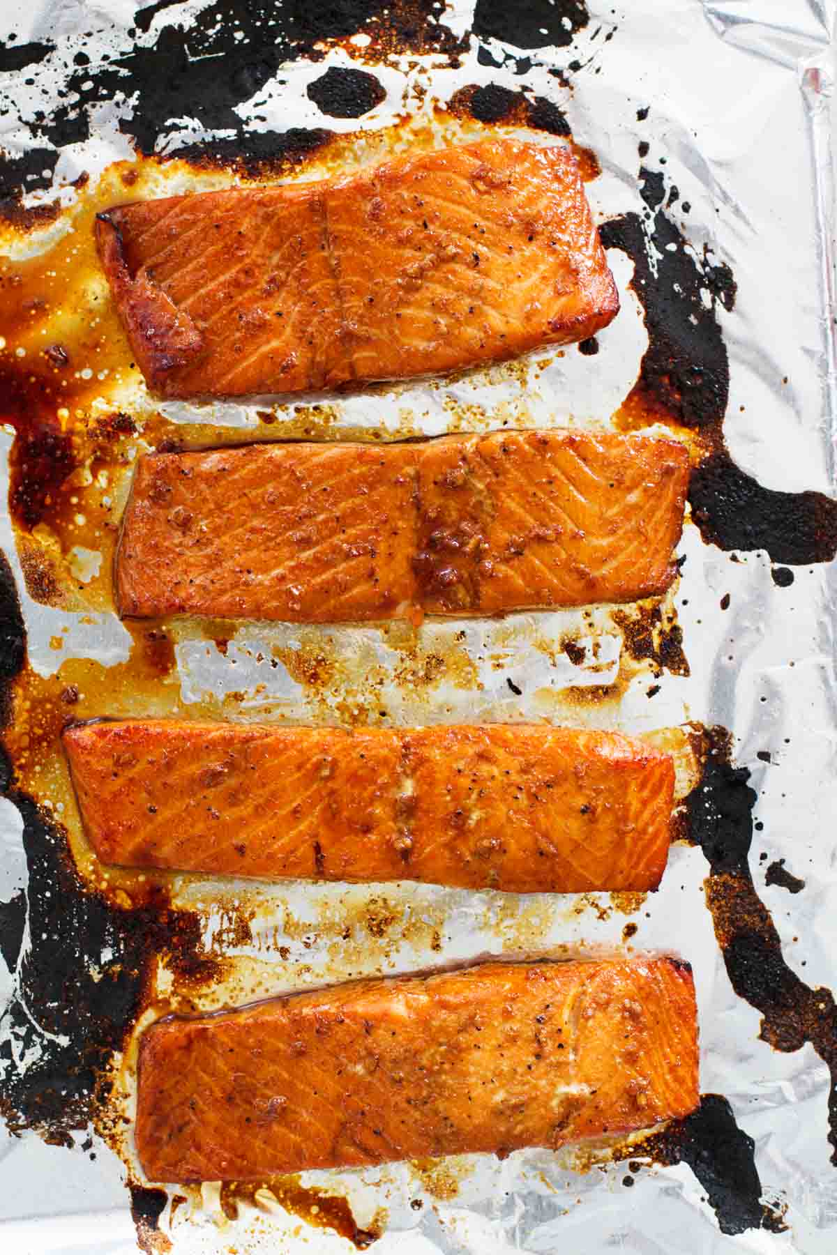 Soy Ginger Salmon broiled on a foil lined baking sheet.