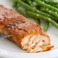 flaked Soy Ginger Salmon dinner with green beans on the plate.