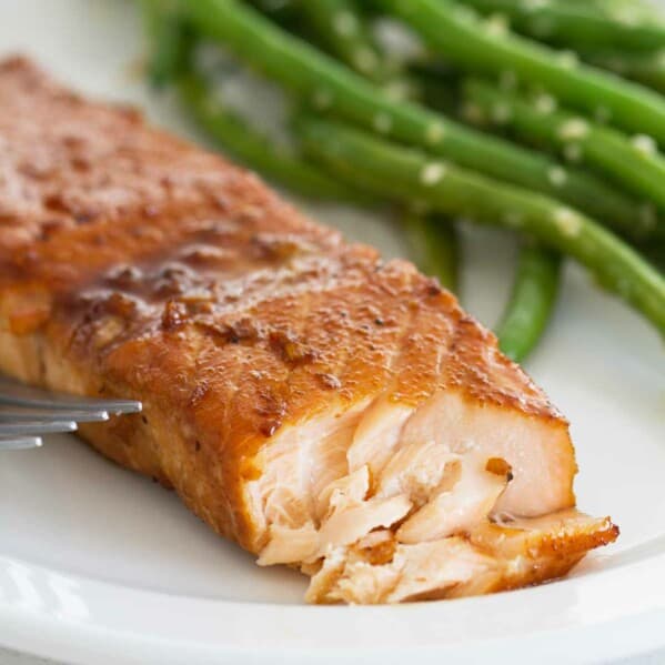 flaked Soy Ginger Salmon dinner with green beans on the plate.