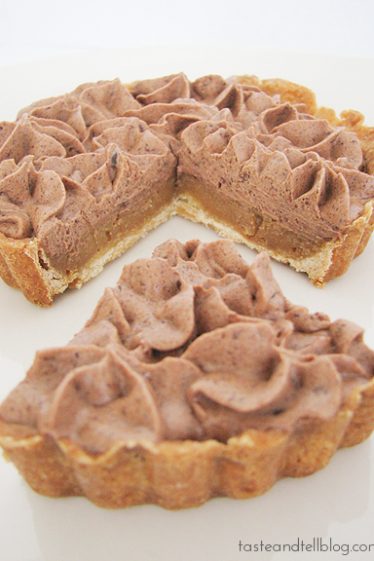 Milk Chocolate and Caramel Tart with slice cut