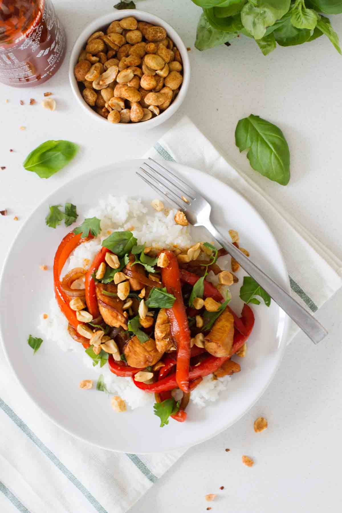 This Spicy Thai Chicken is a go-to every summer - a Thai inspired dish with chicken, bell peppers and lots of basil.