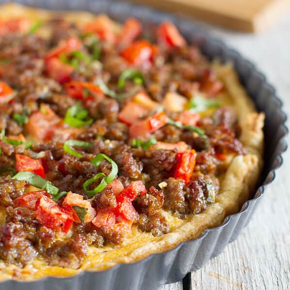 Savory Italian Tart - This quiche-like Italian Tart is filled with Italian sausage, tomatoes, eggs and cheese, all on top of a puff pastry crust. Perfect for breakfast, lunch or dinner!