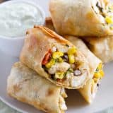 These Southwestern Egg Rolls are a family favorite - filled with chicken, corn, beans, spinach and tex-mex spices. Serve with Avocado Ranch Dipping Sauce.