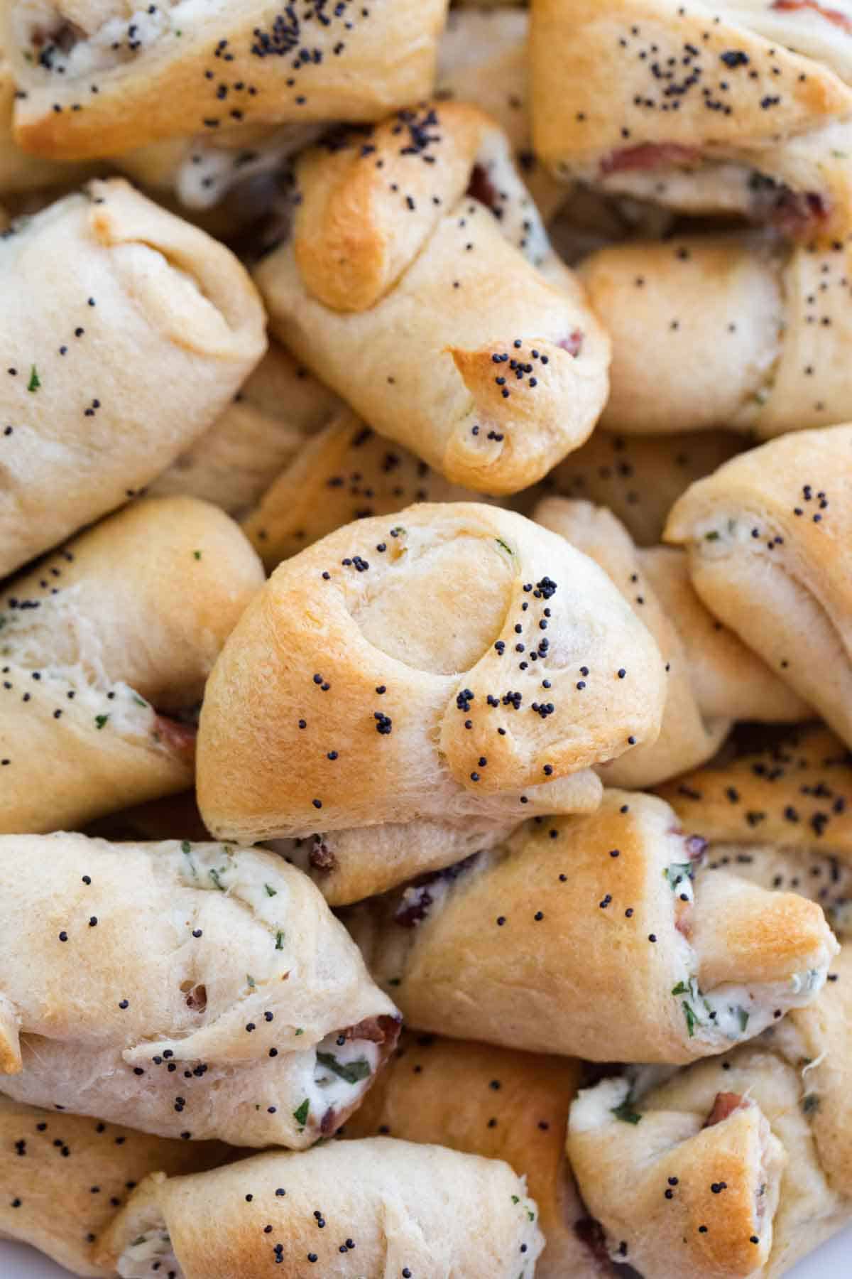 Bacon and Cream Cheese Crescent Appetizers sprinkled with poppy seeds.