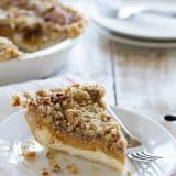 Pumpkin Cheesecake Pie - Cheesecake and pumpkin pie combined! A cheesecake layer is topped with a pumpkin pie layer and then a layer of streusel. Perfect for any holiday!