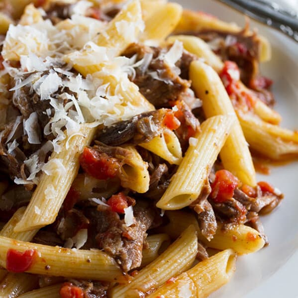 Beef short ribs are simmered in an easy tomato sauce for this Slow Simmered Short Rib Sauce with Pasta. It’s perfect for a Sunday supper!