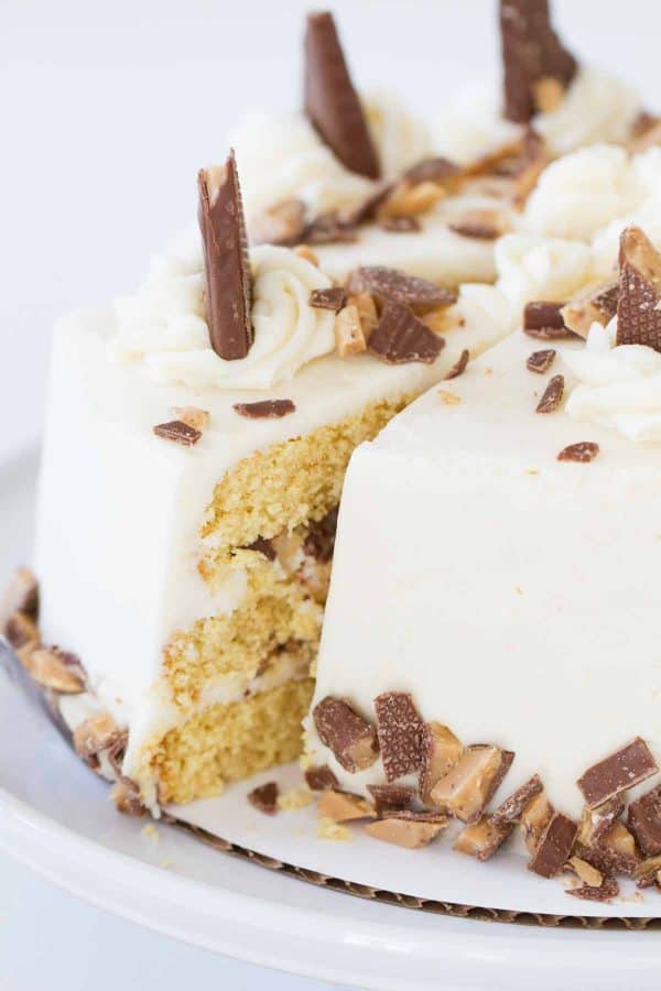 Sugar is cooked to deepen the flavor of this moist Burnt Sugar Candy Bar Cake. Browned butter and crushed candy bars finish off this sweet and delicious cake.