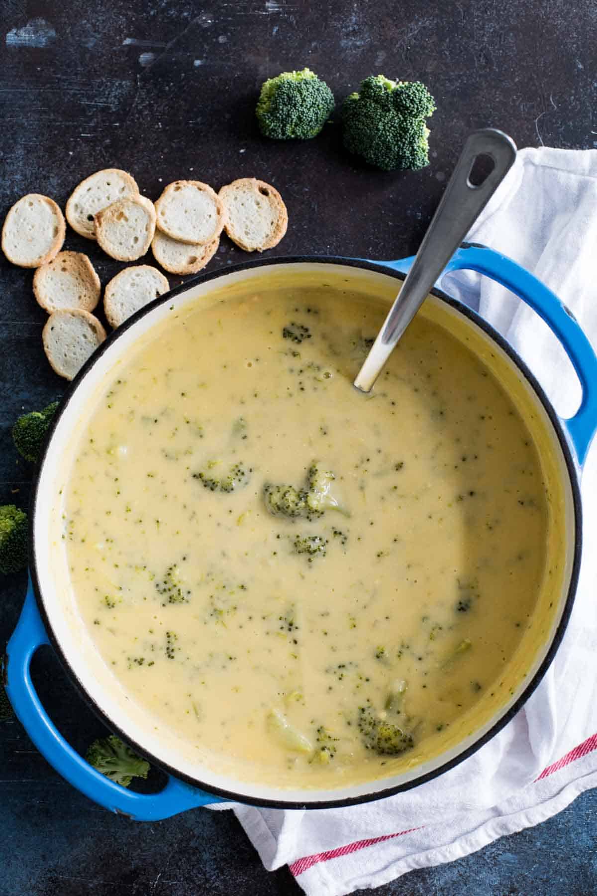 overhead view of broccoli cheese soup in pot