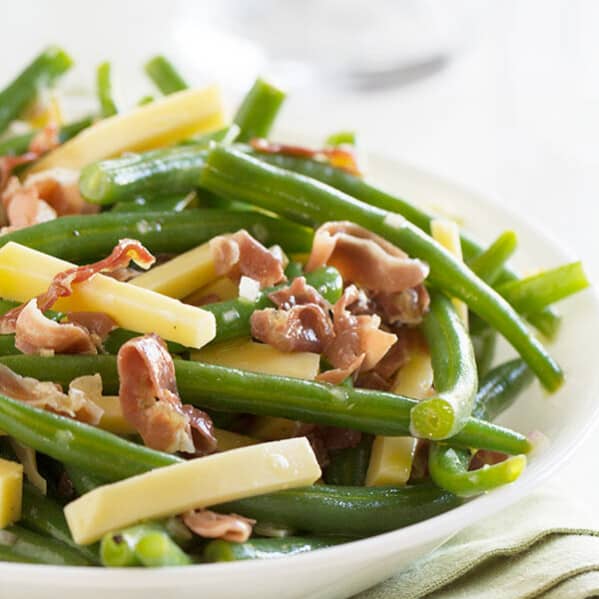 Jazz up your side dish with this Green Bean Recipe with Frizzled Prosciutto and Gouda. It is quick and delicious and a little different from the norm.