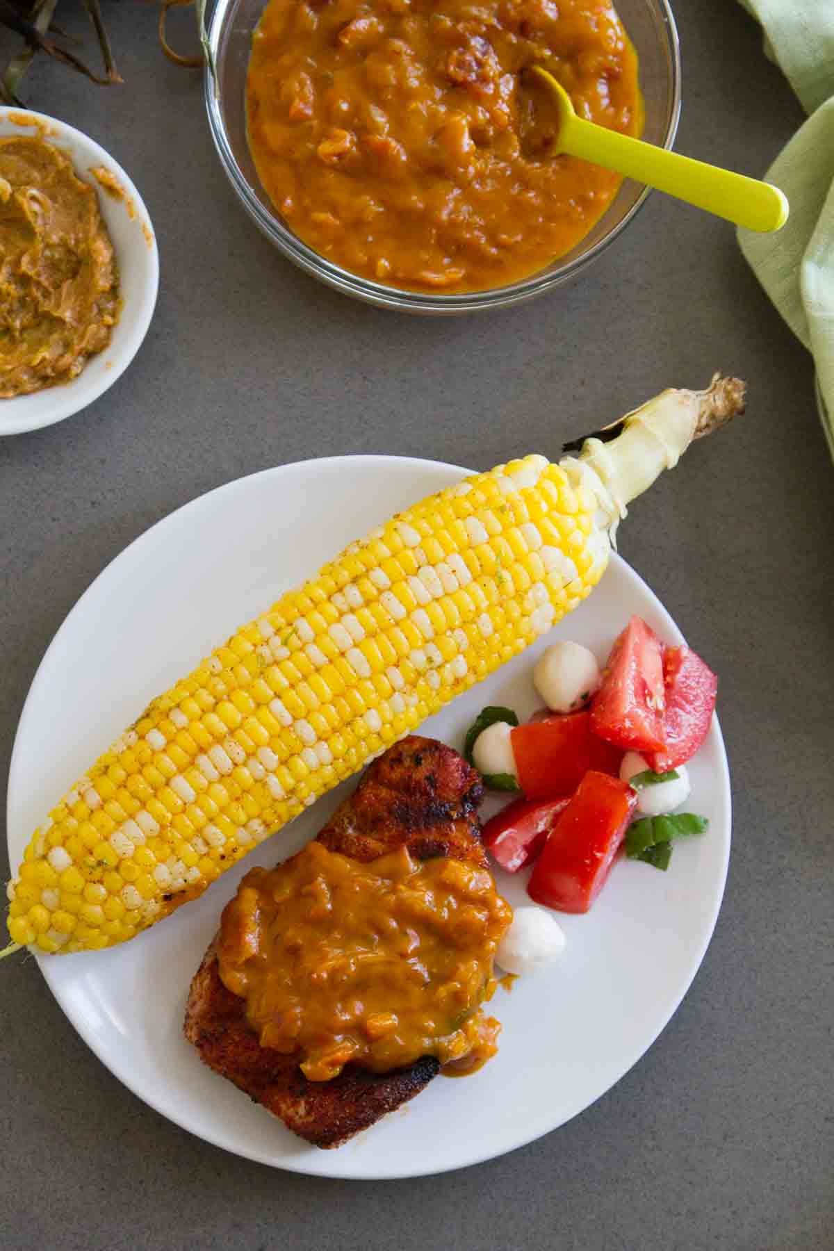 Grilled Pork Chops with Bacon Barbecue Sauce on a plate