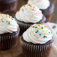 Devil's Food Cupcakes with Fluffy Frosting topped with sprinkles.