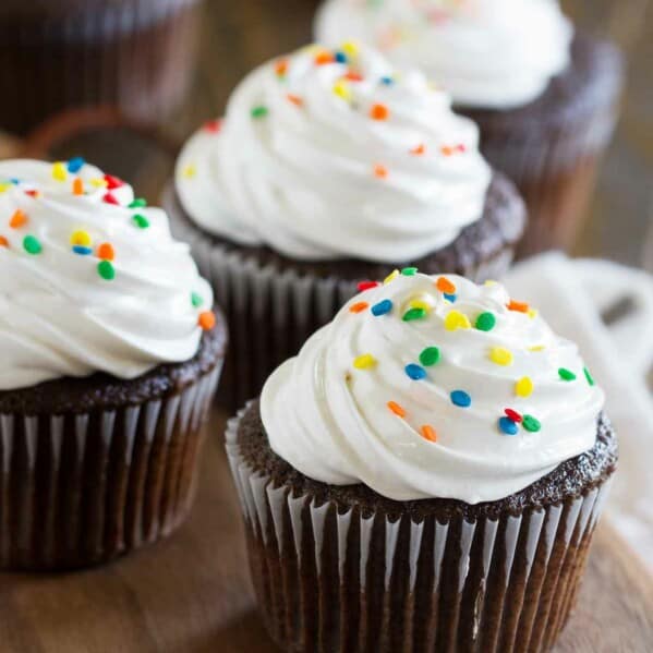 Devil's Food Cupcakes with Fluffy Frosting topped with sprinkles.
