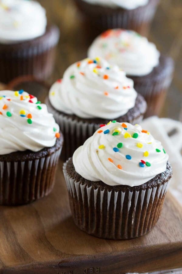 Devil's Food Cupcakes with Fluffy Frosting topped with sprinkles.