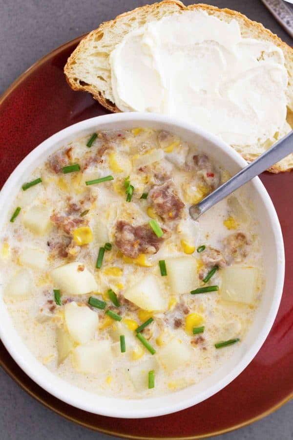close up of sausage corn chowder in bowl