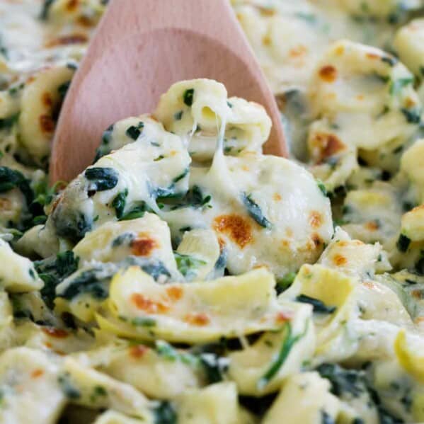 Everyone’s favorite dip gets a makeover - into an easy family dinner! This Spinach and Artichoke Tortellini Bake is cheesy, creamy and super easy!