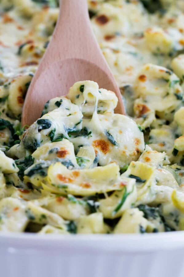 Everyone’s favorite dip gets a makeover - into an easy family dinner! This Spinach and Artichoke Tortellini Bake is cheesy, creamy and super easy!