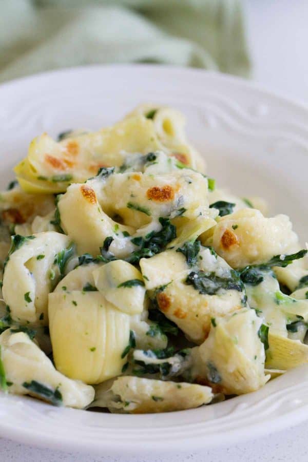 Everyone’s favorite dip gets a makeover - into an easy family dinner! This Spinach and Artichoke Tortellini Bake is cheesy, creamy and super easy!