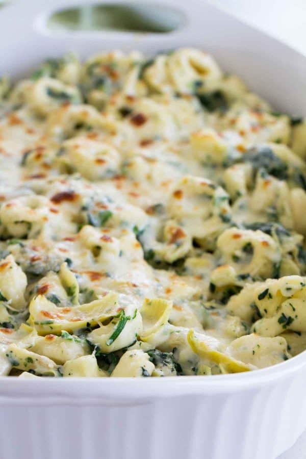 Everyone’s favorite dip gets a makeover - into an easy family dinner! This Spinach and Artichoke Tortellini Bake is cheesy, creamy and super easy!