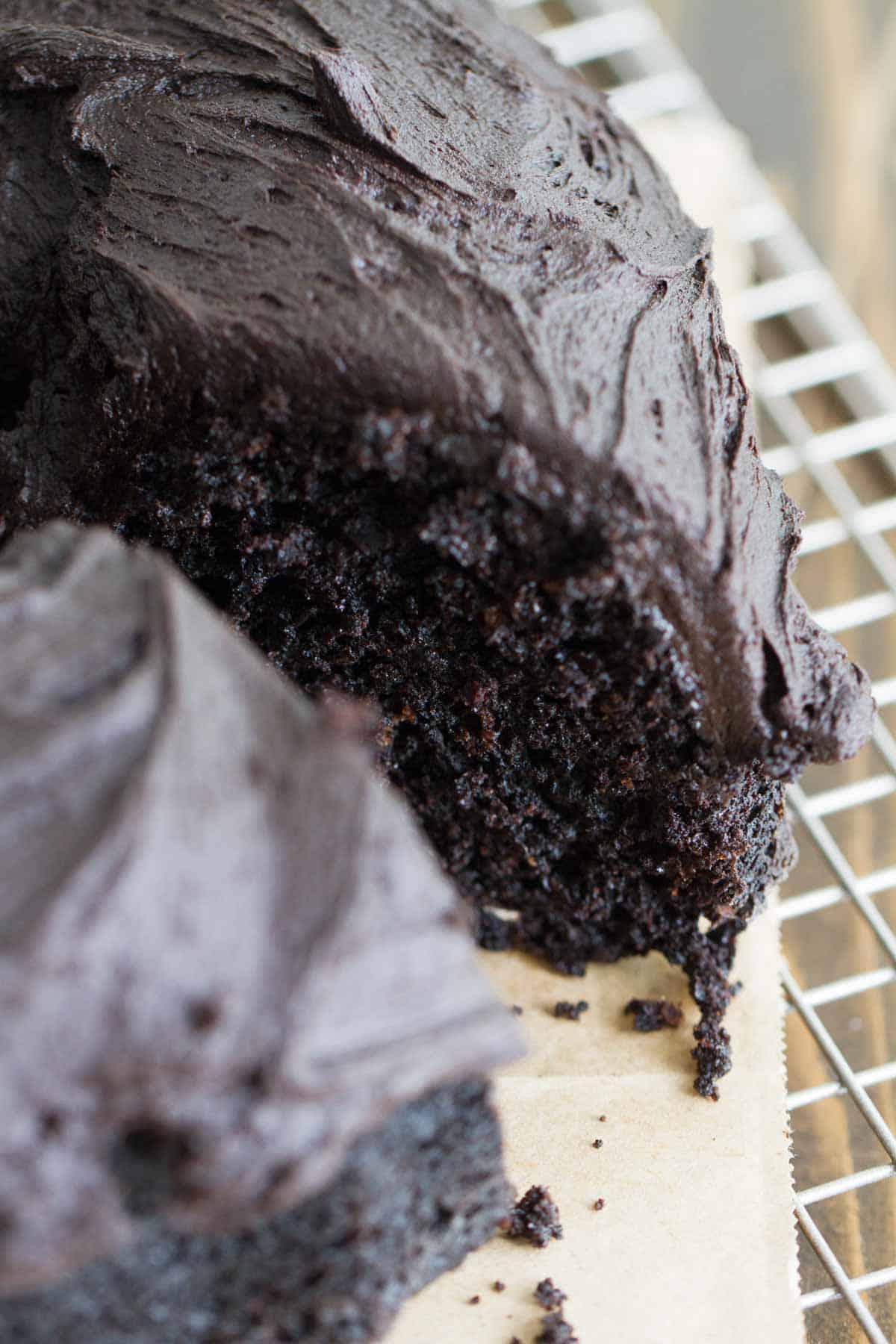 Dark Chocolate Bundt Cake with hints of root beer with a slice taken from it.