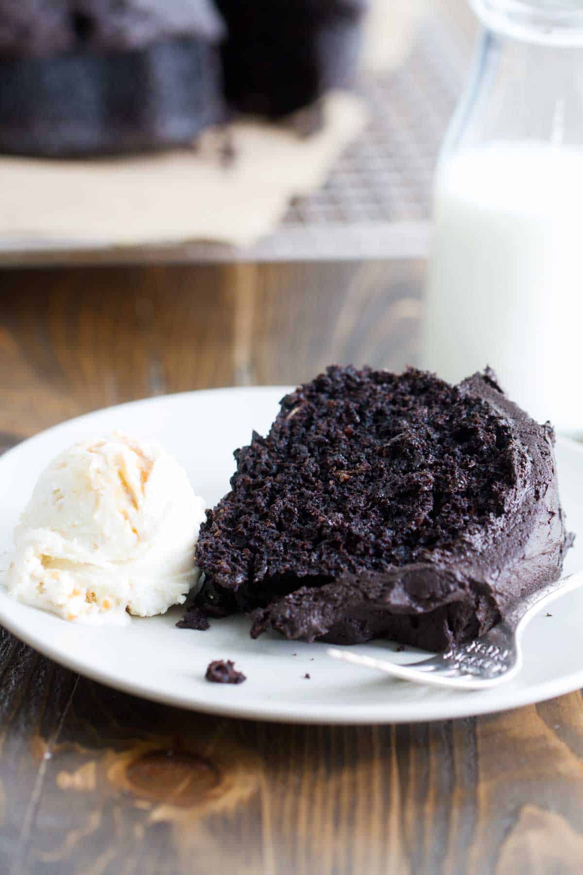 slice of root beer bundt cake served with a scoop of vanilla ice cream.