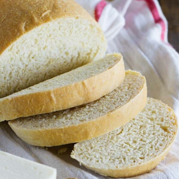 Sliced polenta bread with butter next to it.