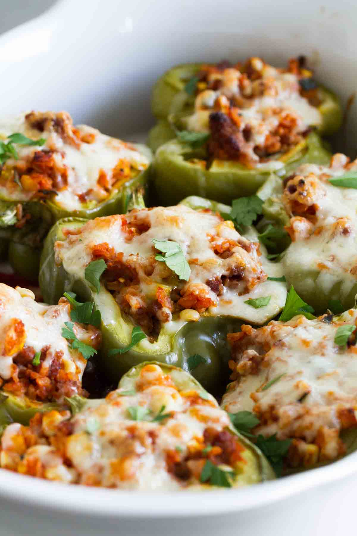 The perfect way to get in your veggies, these Vegetable and Sausage Stuffed Peppers are stuffed with lots of veggies, rice and flavorful sausage. The perfect end of summer meal!
