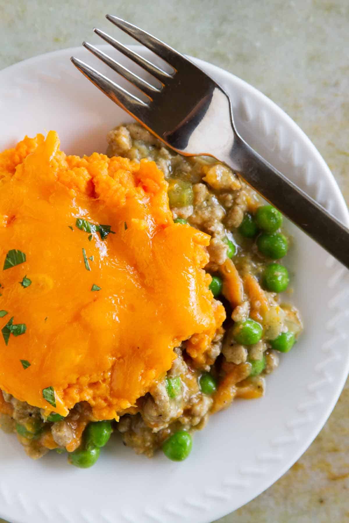 Plate with a serving of Turkey Shepherd's Pie with Sweet Potatoes.