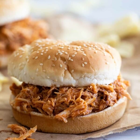 Crockpot BBQ Pulled Chicken on a hamburger bun.