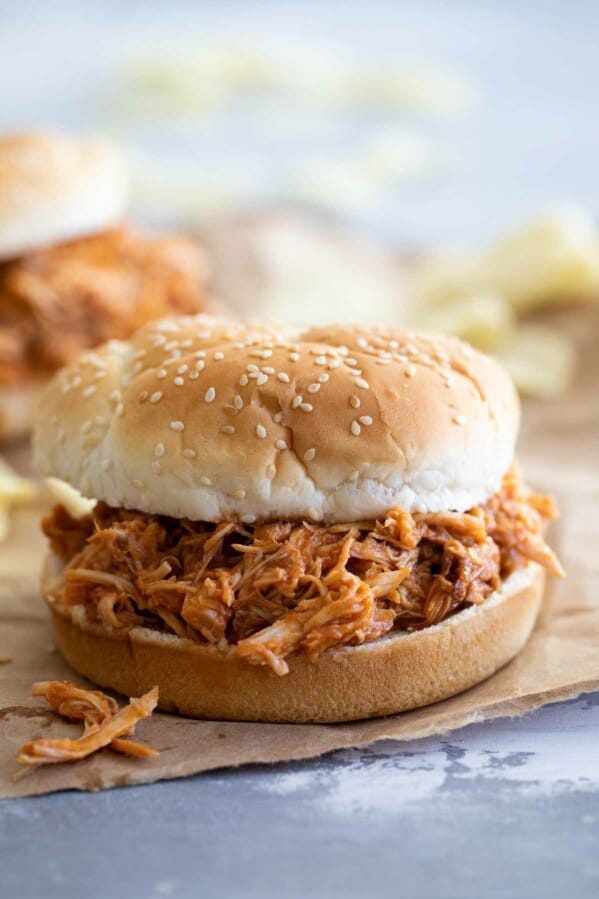 Crockpot BBQ Pulled Chicken on a hamburger bun.