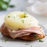 Dinner in a hurry - this Hawaiian Chicken with Ham and Pineapple cooks up in less than 30 minutes. Soy sauce seasoned chicken is topped with ham, pineapple, and melty cheese for a dinner you’ll want to make over and over again.