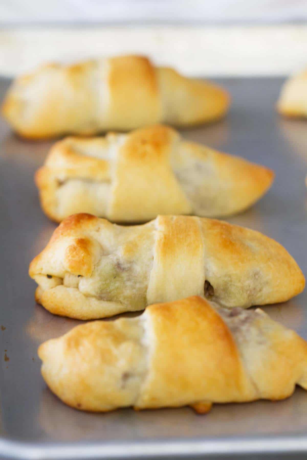 close up of Cabbage and Beef Bundles on a baking sheet