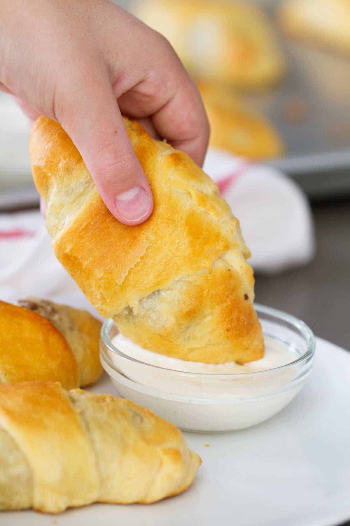 Dipping Cabbage and Beef Bundles in Horseradish Mayo