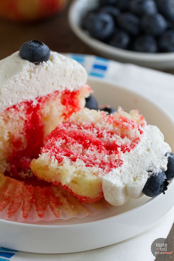 Cupcakes go patriotic with these Jello Poke Cupcakes that are streaked with red, then topped with white and blue. You can easily change the jello flavor and the topping for different holidays or flavors.