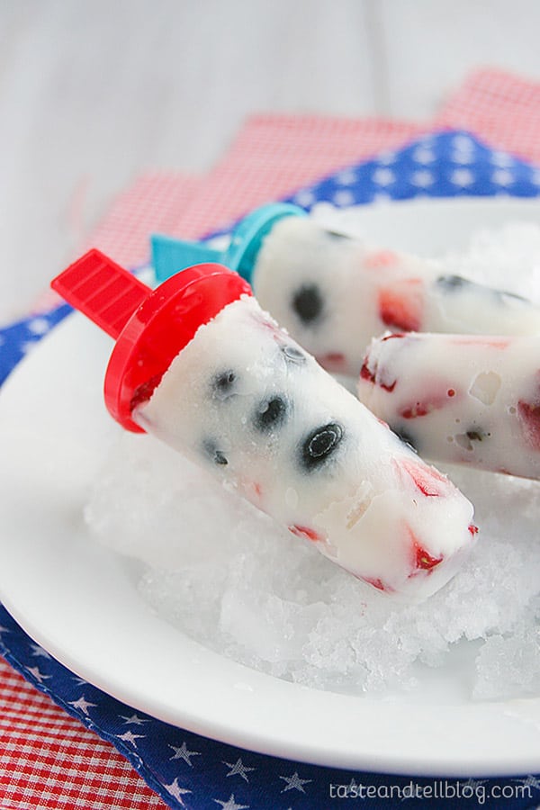 A healthier 4th of July treat! Fresh blueberries and strawberries are frozen in a milk mixture, sweetened with honey in these delicious Red, White and Blue Milk Pops.
