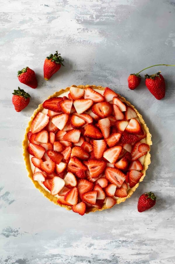 full strawberry tart topped with fresh strawberries