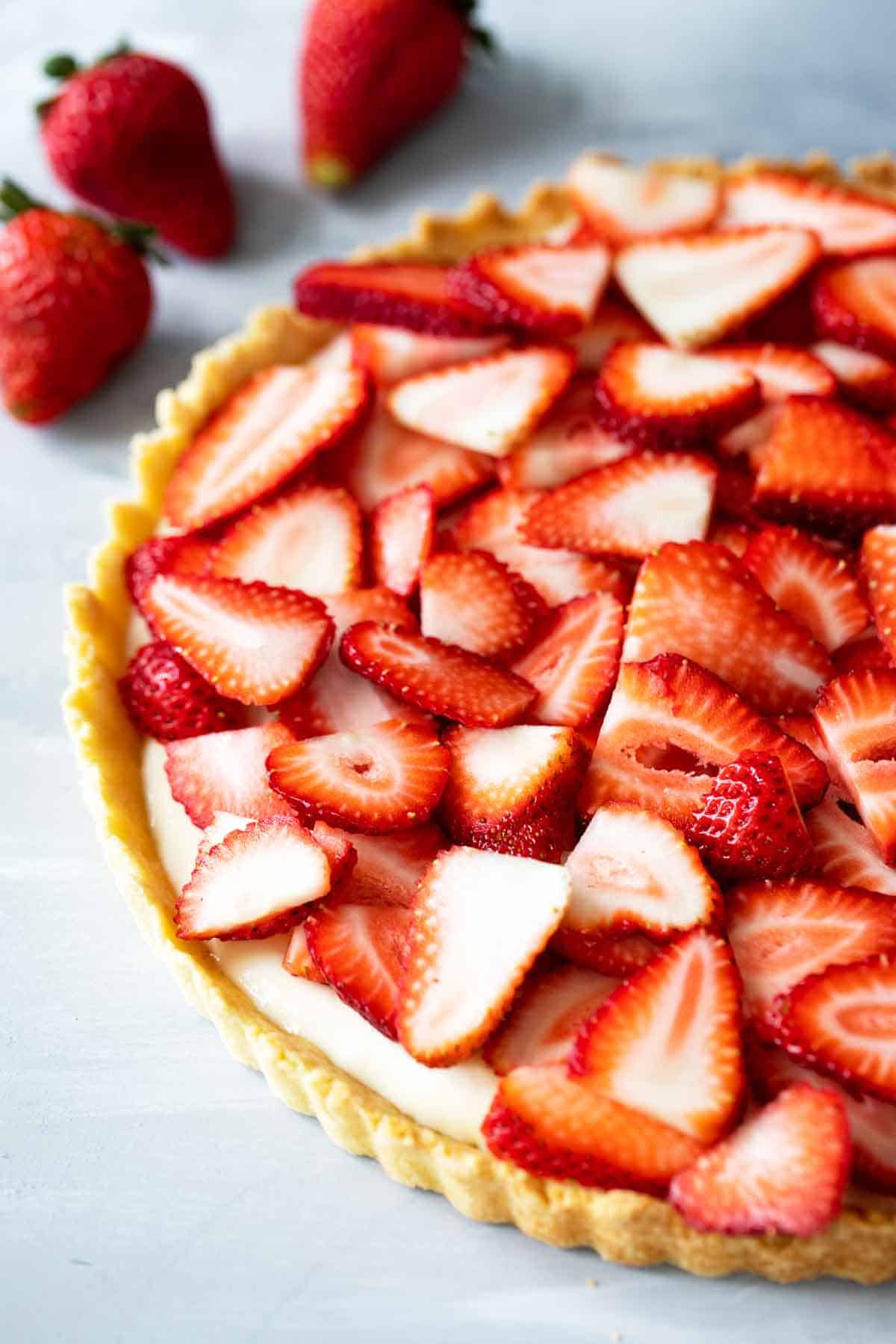 Strawberry lovers will want a second slice of this Strawberry Tart with pastry crust and a simple cream filling. Top it off with strawberries for a fresh, delicious dessert. Strawberry tart made with fresh strawberries