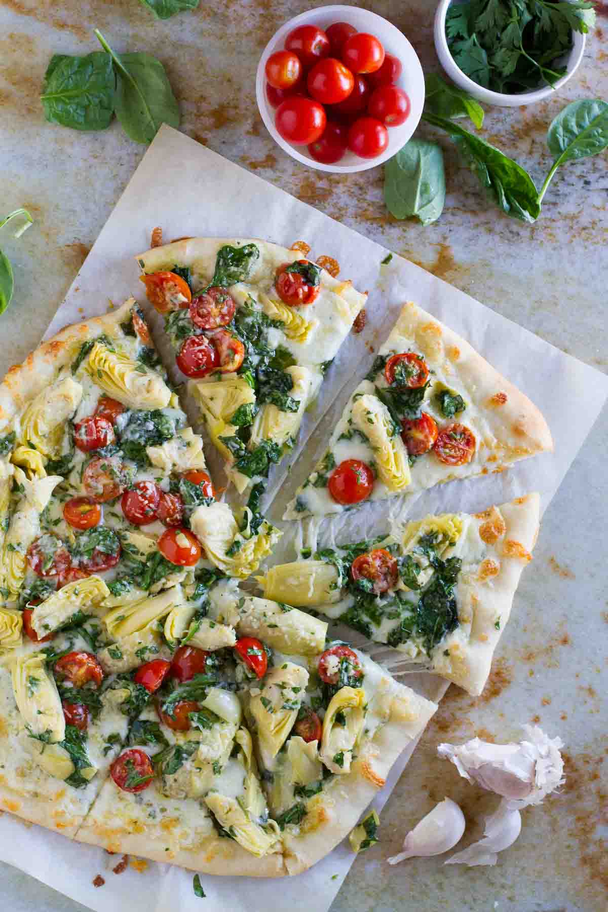 overhead view of Artichoke, Tomato and Spinach Pizza