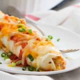 Cream Cheese Chicken Enchiladas on a plate.