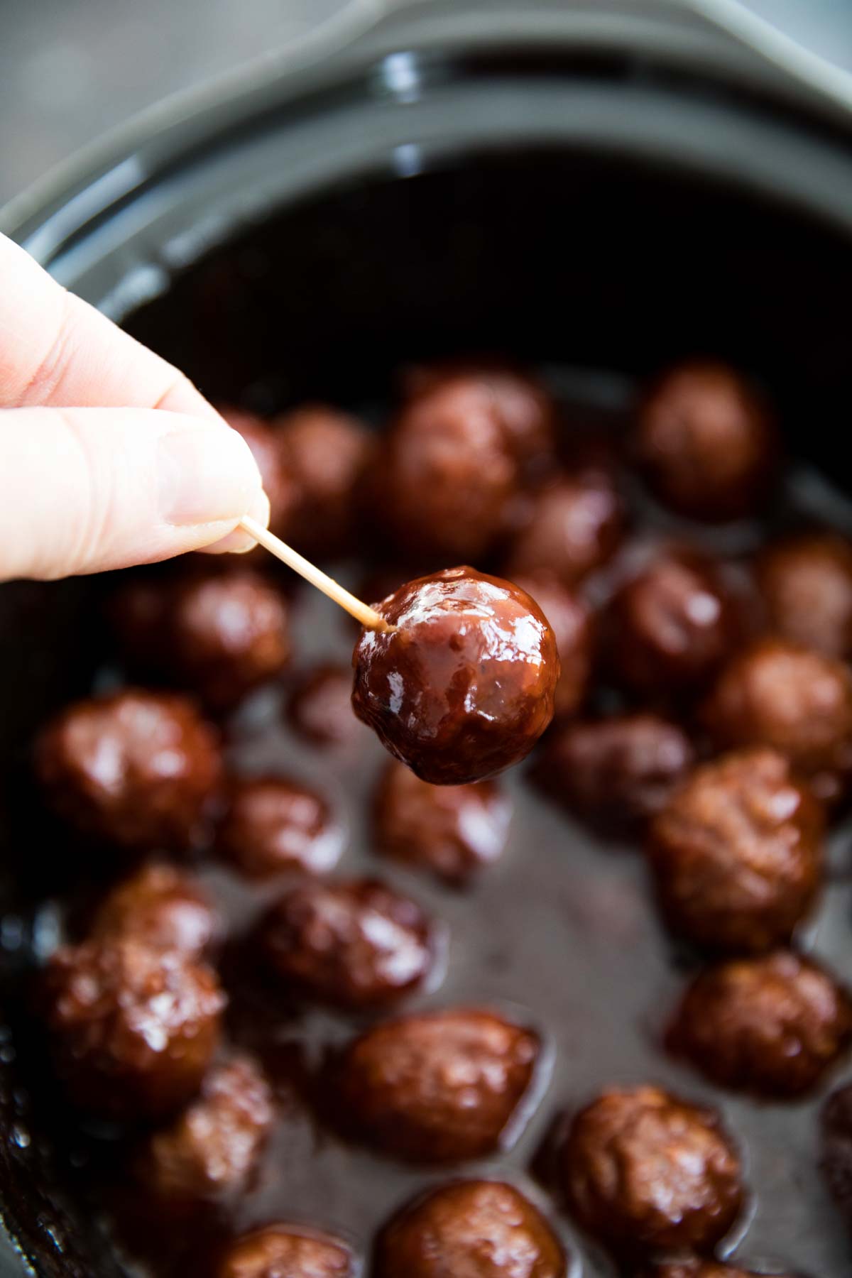 Crockpot BBQ Grape Jelly Meatballs on a toothpick