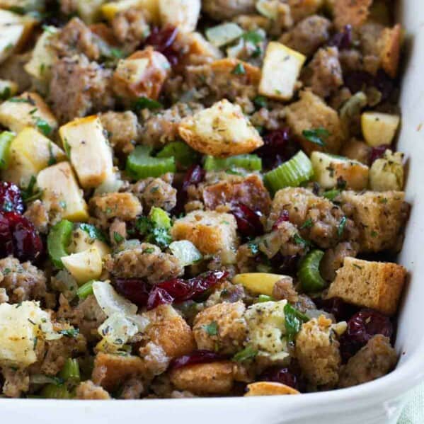 casserole dish of sausage stuffing with apples and cranberries