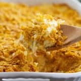 scoop of funeral potatoes in a casserole dish