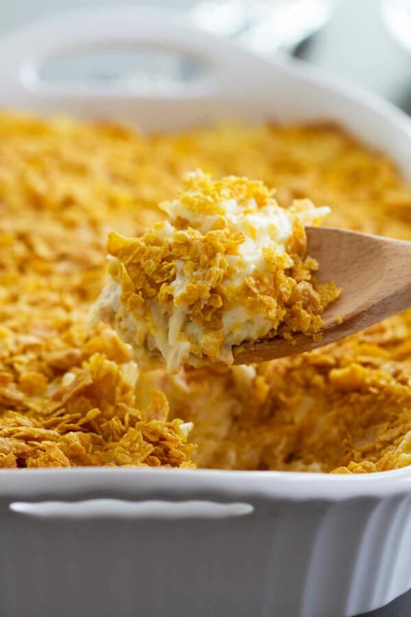 scoop of funeral potatoes in a casserole dish