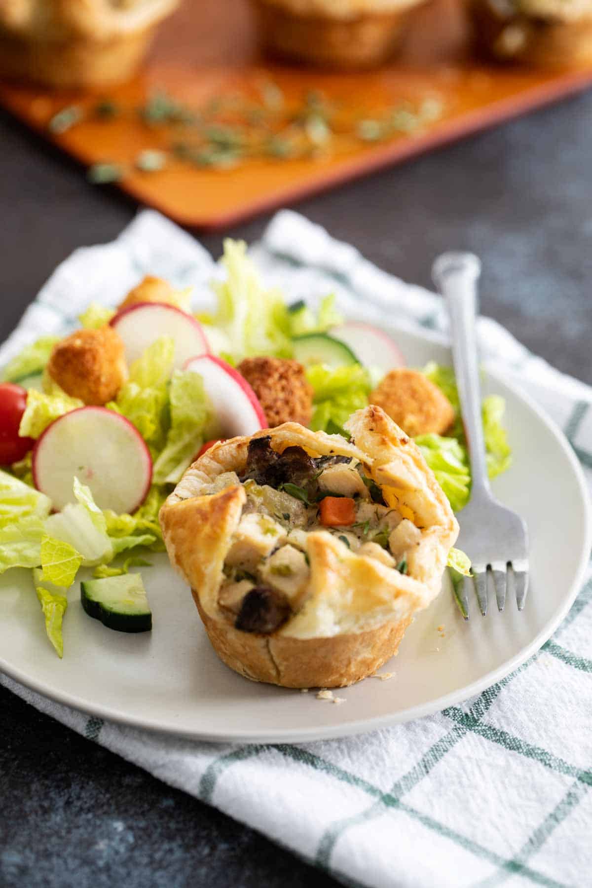 Muffin Tin Chicken Pot Pie served with a green salad.