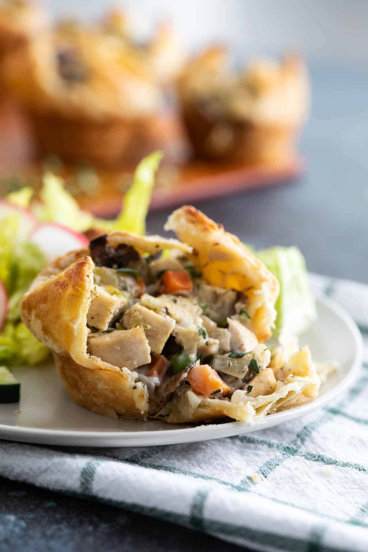 Mini Chicken Pot Pie with Puff Pastry on a plate for serving.