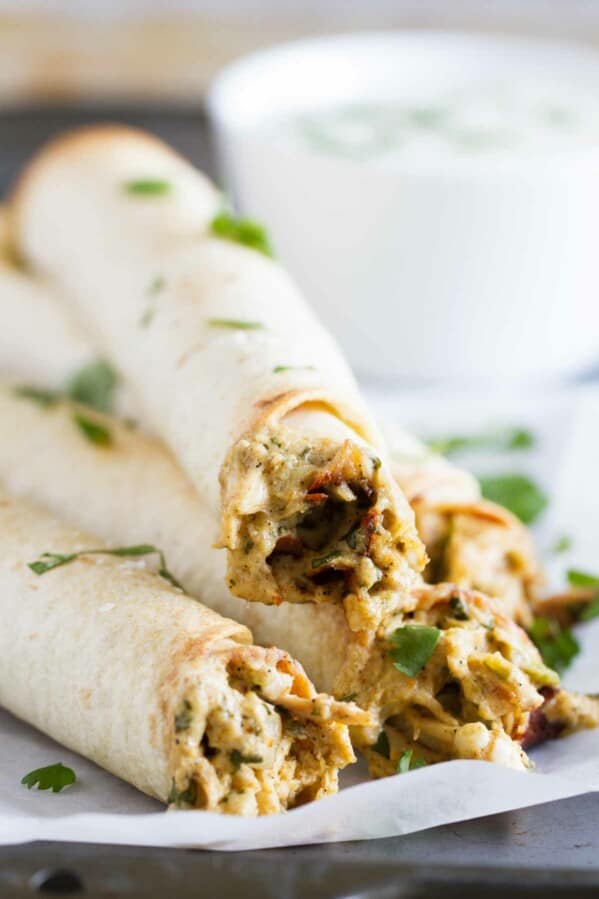 If you are looking for a chicken dinner that will satisfy both kids and adults, these Baked Creamy Chicken Taquitos are your answer! Creamy and flavorful and served with a delicious dressing, everyone loves this dinner idea!