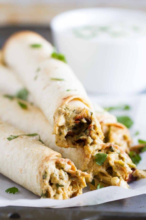 If you are looking for a chicken dinner that will satisfy both kids and adults, these Baked Creamy Chicken Taquitos are your answer! Creamy and flavorful and served with a delicious dressing, everyone loves this dinner idea!