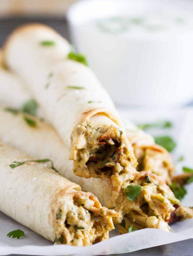 If you are looking for a chicken dinner that will satisfy both kids and adults, these Baked Creamy Chicken Taquitos are your answer! Creamy and flavorful and served with a delicious dressing, everyone loves this dinner idea!