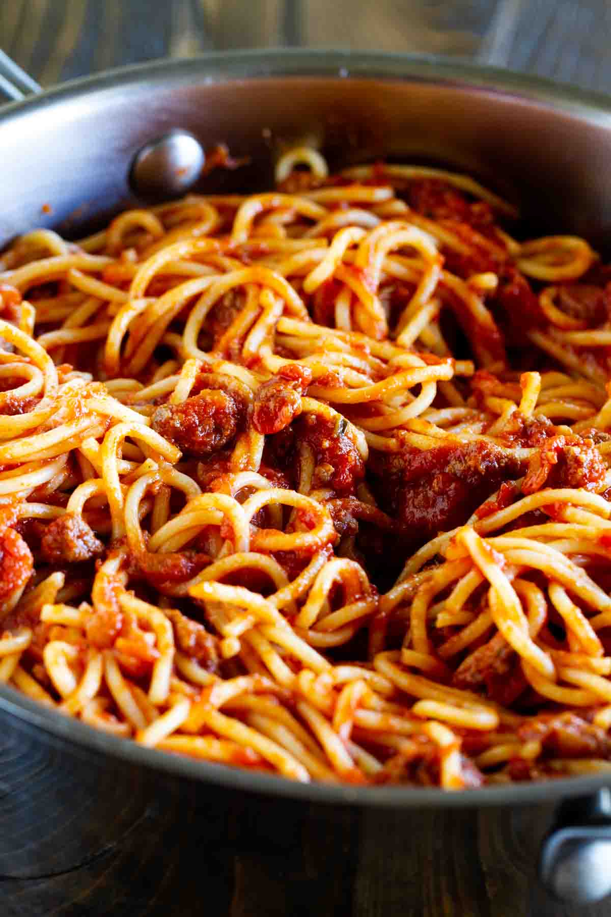 Spaghetti with meat sauce in a pan.