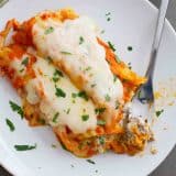 Taking a bite of Ground Beef Stuffed Manicotti